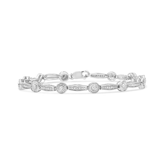 White metal bracelet with round white gemstones in miracle and pave settings, shown from a front angle.