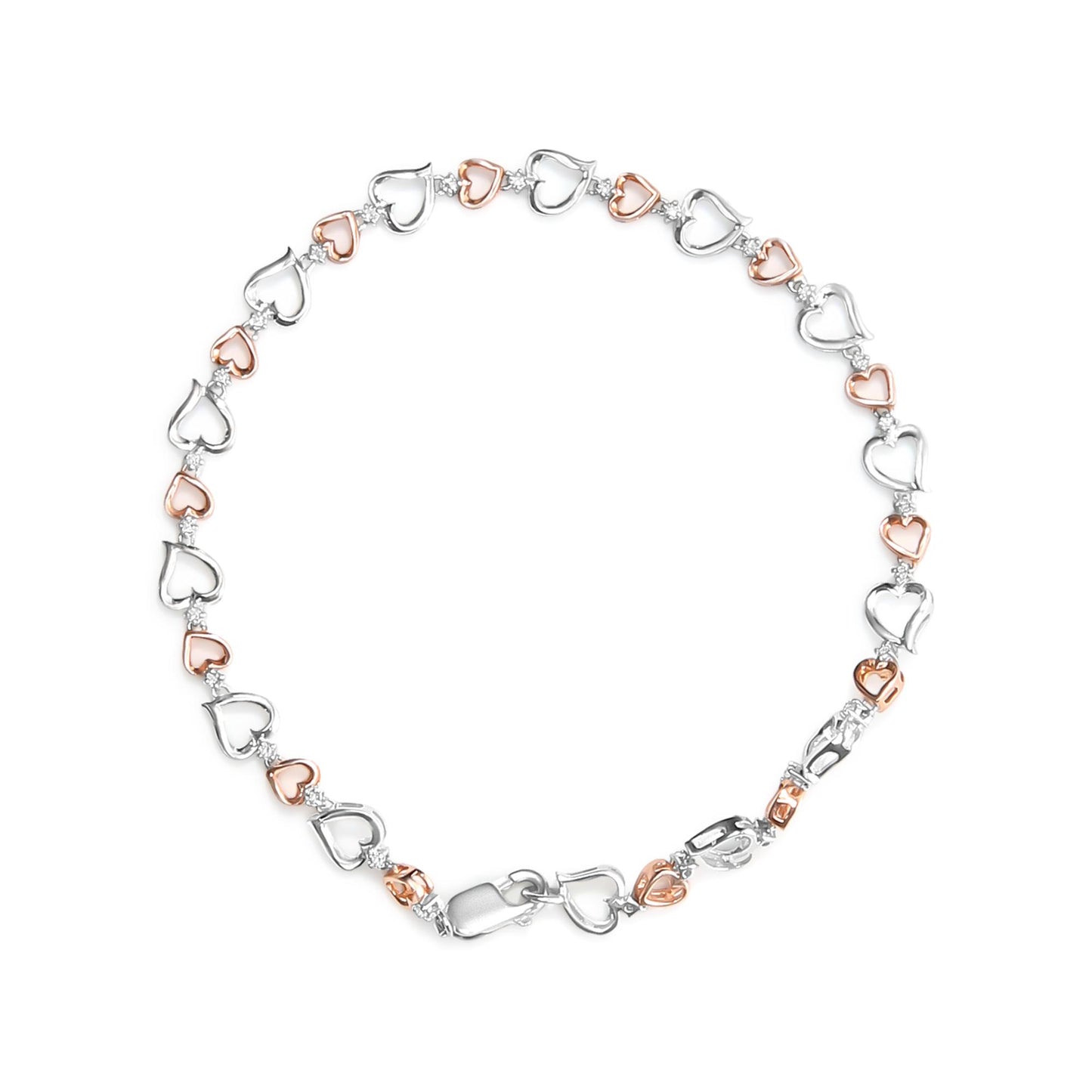 Top-down view of a white and rose metal heart-link bracelet accented with white round prong-set gemstones.