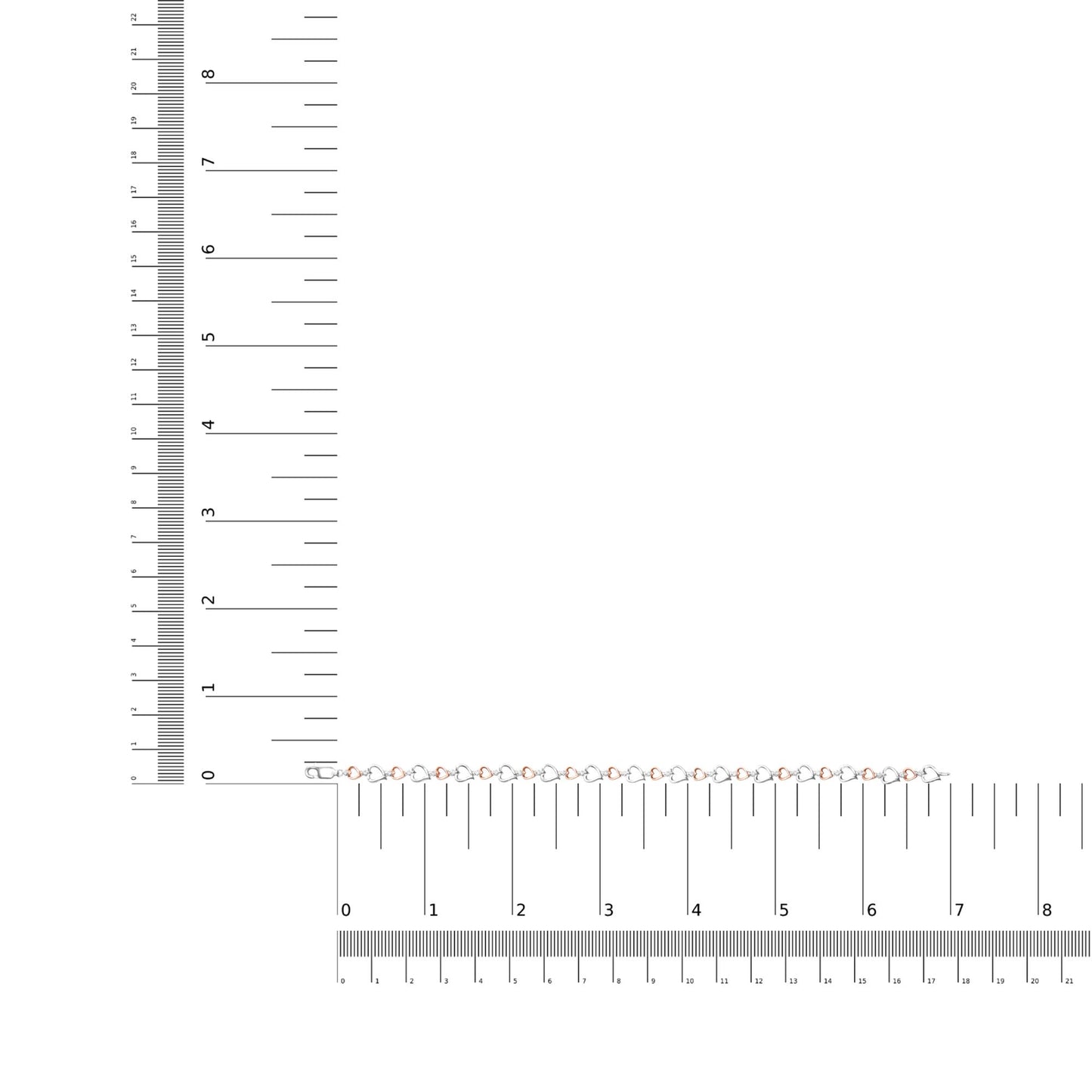 Bracelet with alternating white and rose heart-shaped links, each set with a round white gemstone, displayed flat on a ruler for size reference, top-down angle.