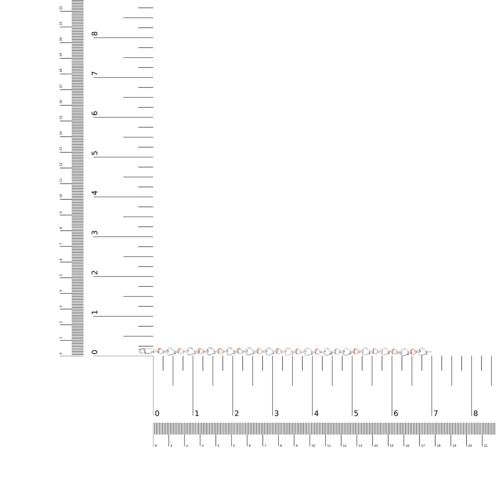 Bracelet with alternating white and rose heart-shaped links, each set with a round white gemstone, displayed flat on a ruler for size reference, top-down angle.