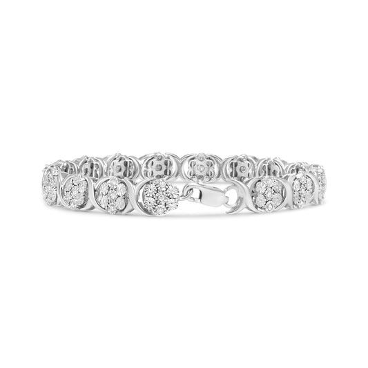 White metal bracelet with round white gemstones in miracle settings, shot from the front at a slight angle.