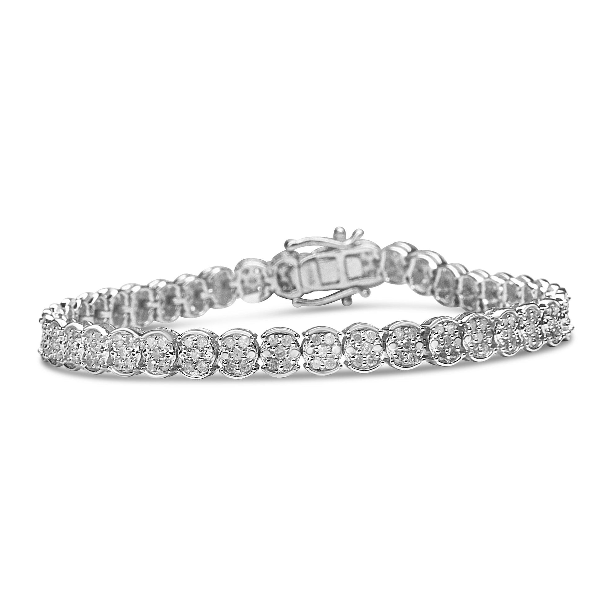 White metal bracelet with round white gemstones in prong settings, shown from a front angled side view.