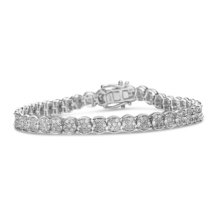 White metal bracelet with round white gemstones in prong settings, shown from a front angled side view.