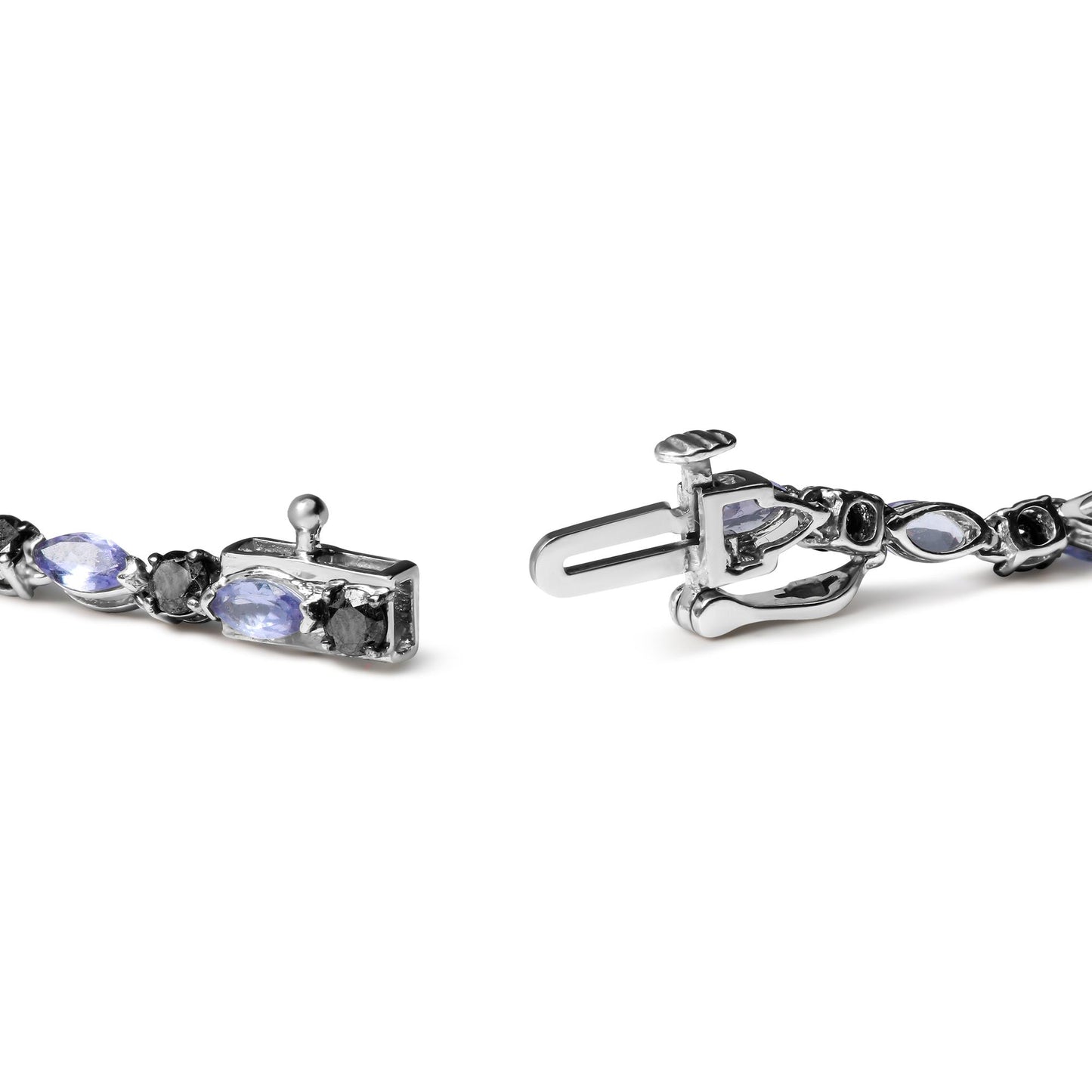 Close-up angled view of a white metal bracelet clasp featuring alternating marquise-shaped blue gemstones and round black gemstones in prong settings.