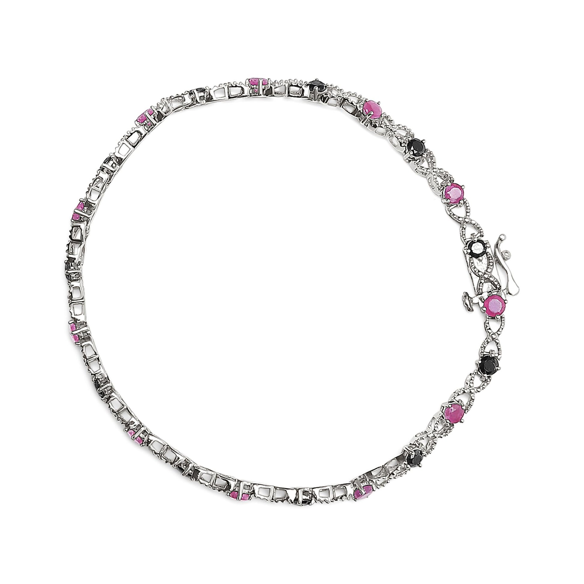 White metal bracelet with alternating pink and black round gemstones in prong settings, shown from a top-down angle.