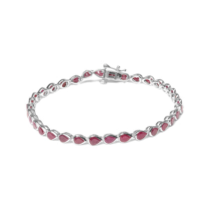 White metal bracelet with linked pear-shaped red gemstones, shown from an angled top view.