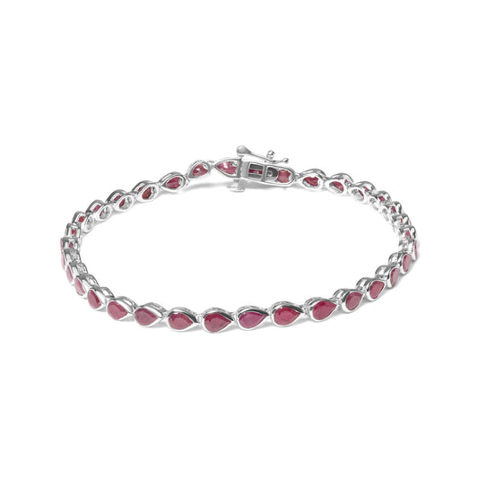 White metal bracelet with linked pear-shaped red gemstones, shown from an angled top view.