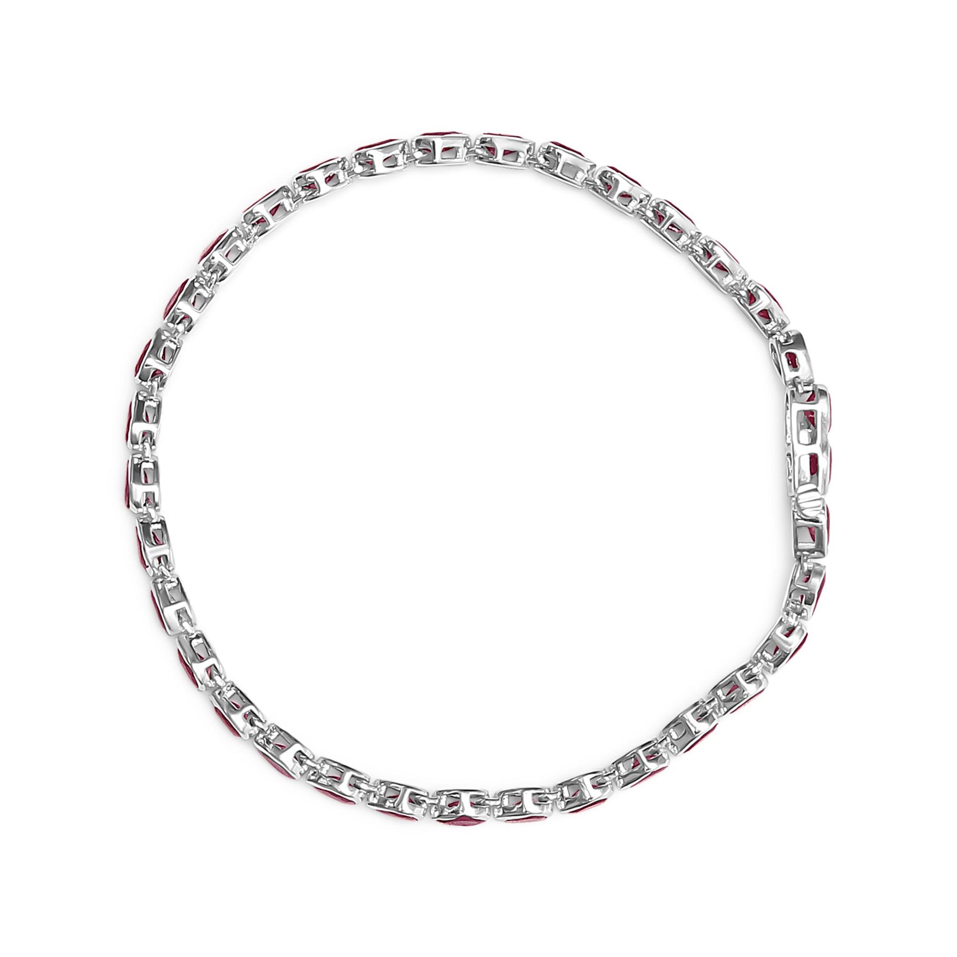 Top-down view of a white metal bracelet with alternating links featuring red gemstones, laid flat on a white background.