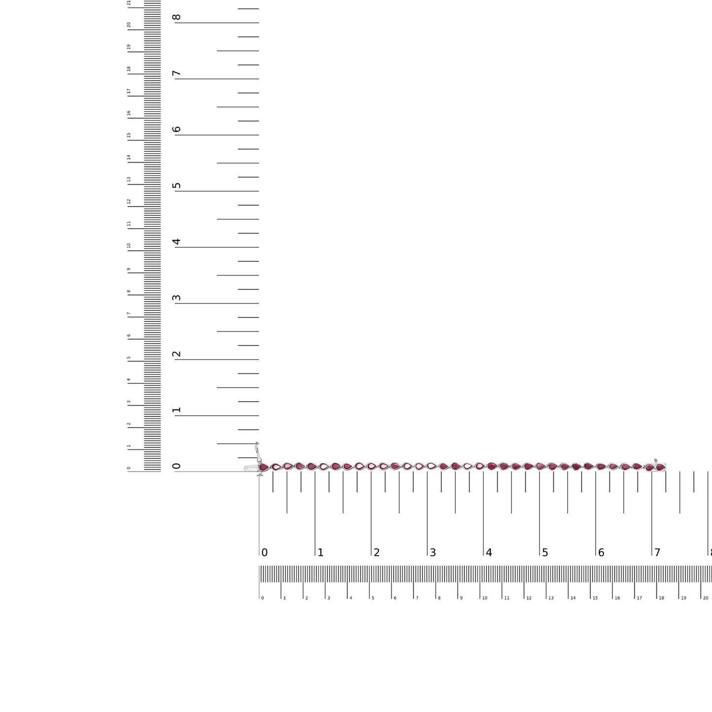 Top-down view of a white metal bracelet with linked red gemstones, displayed on a ruler for size reference.