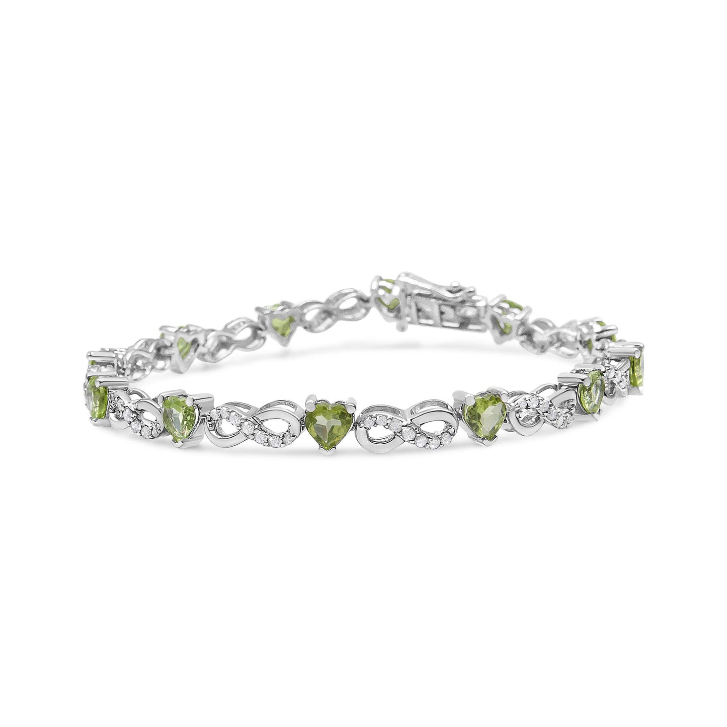 White metal bracelet with alternating heart-shaped green gemstones and infinity symbols set with small white gemstones, shown at a slight angle.