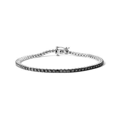 White metal bracelet with round black gemstones in prong settings, shot at a slight angle on a white background.