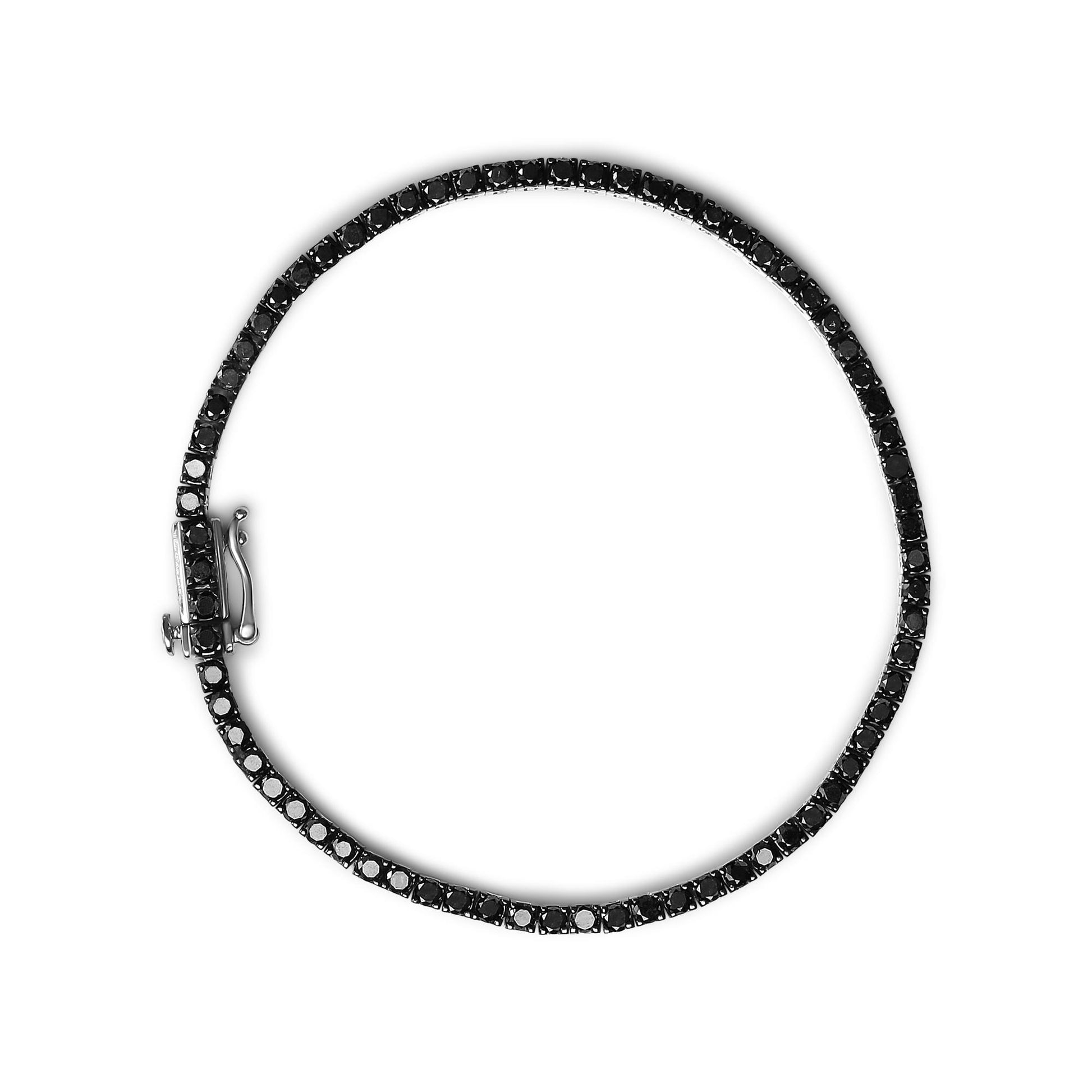 White metal bracelet with round black gemstones in prong settings, shown flat from a top-down angle.