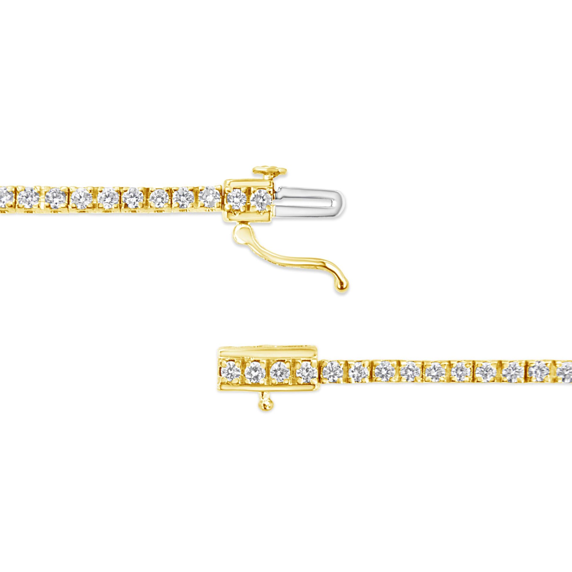 Close-up top view of a yellow bracelet with round prong-set brownish gemstones, showcasing the clasp and part of the band.