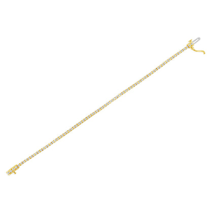 Yellow metal bracelet with white round gemstones in prong settings, shown flat in a top-down angled view.
