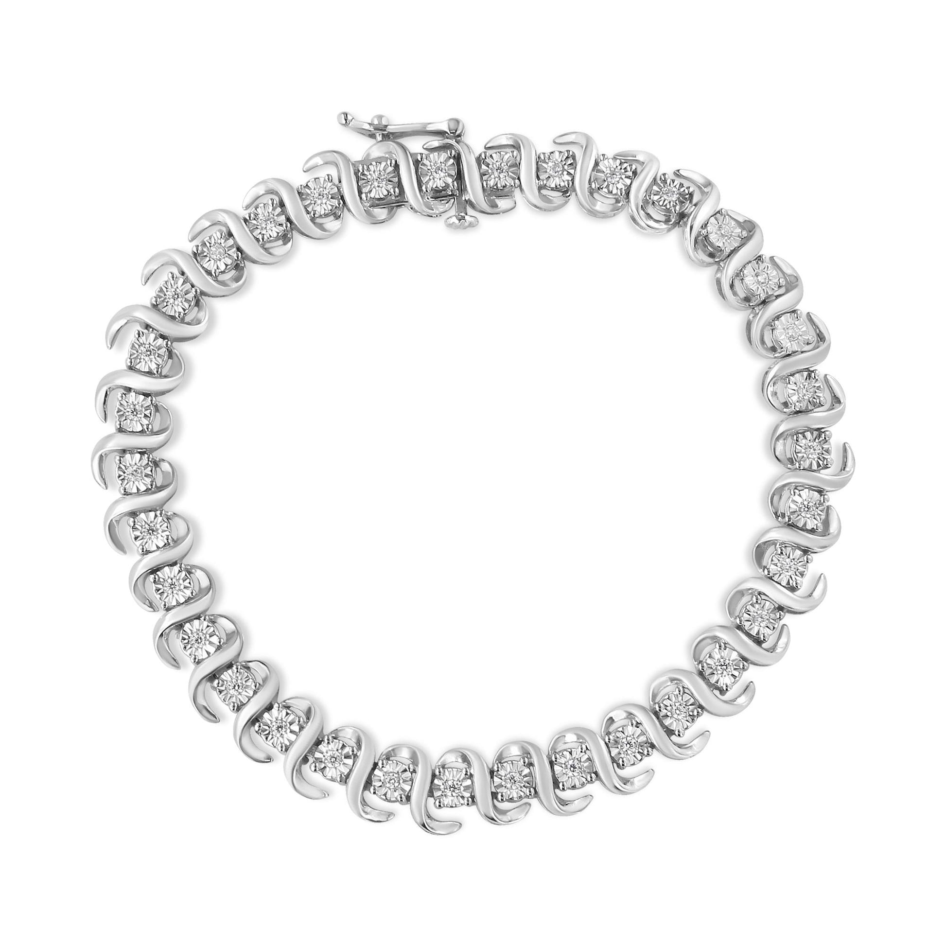 Top-down view of a white metal bracelet featuring round white gemstones set in a spiral design.