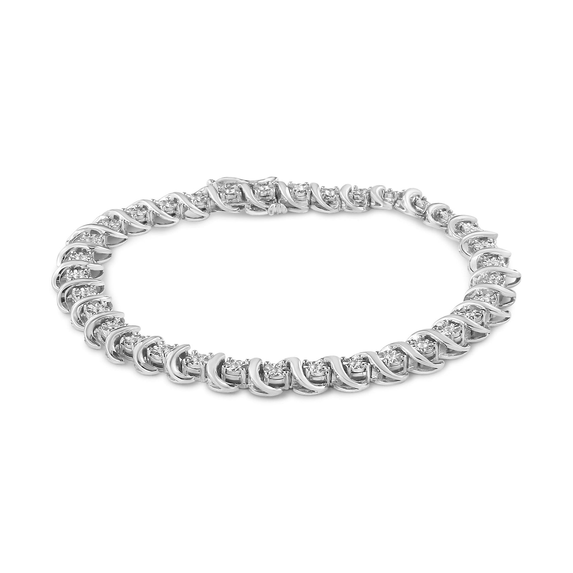 Bracelet with round white gemstones in a miracle setting on white metal, shown in a top angled view.
