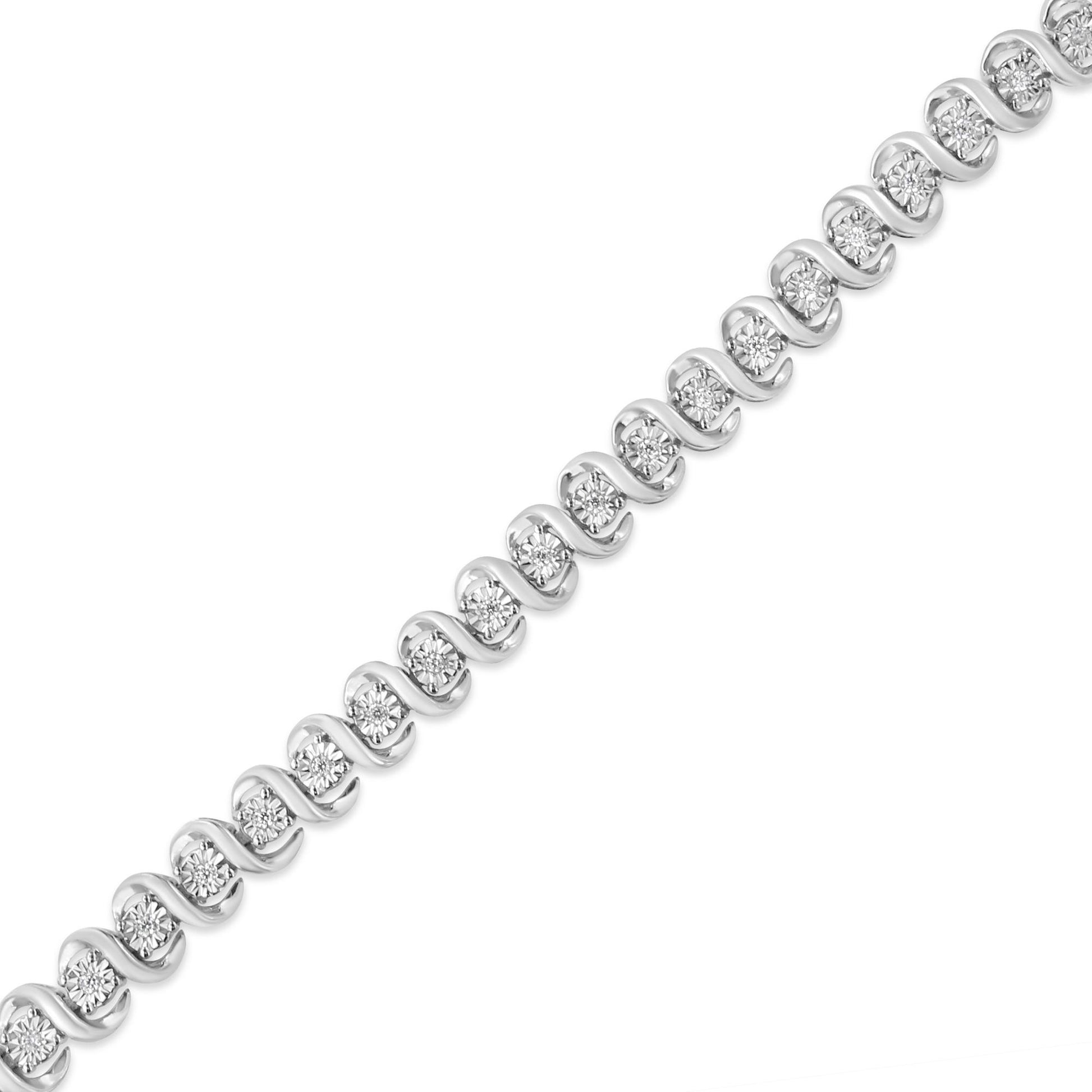 Diagonal close-up of a white metal bracelet with round white gemstones in a miracle setting.