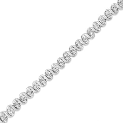 Diagonal close-up of a white metal bracelet with round white gemstones in a miracle setting.
