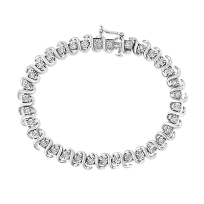 Top-down view of a white metal bracelet featuring round white gemstones set in a continuous alternating swirl design with a clasp closure.