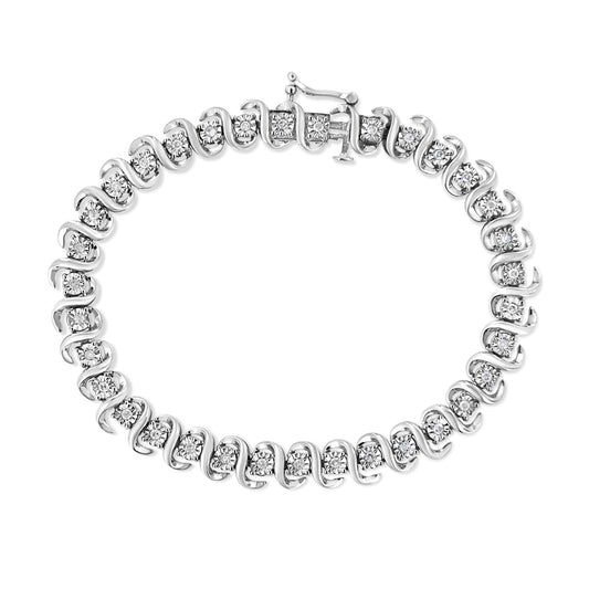 Top-down view of a white metal bracelet featuring round white gemstones set in a continuous alternating swirl design with a clasp closure.
