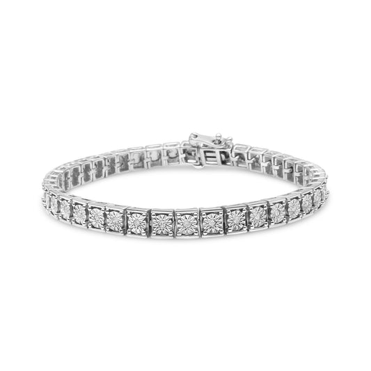 White metal bracelet with round white gemstones in a miracle setting, shown at a slight angled front view.
