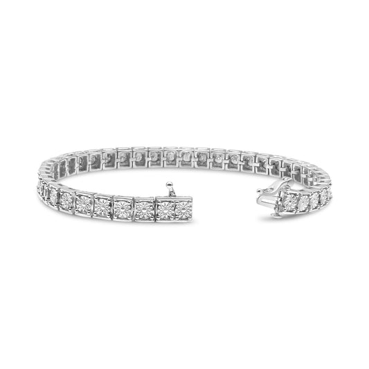 Bracelet with round white gemstones in miracle setting on a white metal base, shown at a slight side angle on a white background.