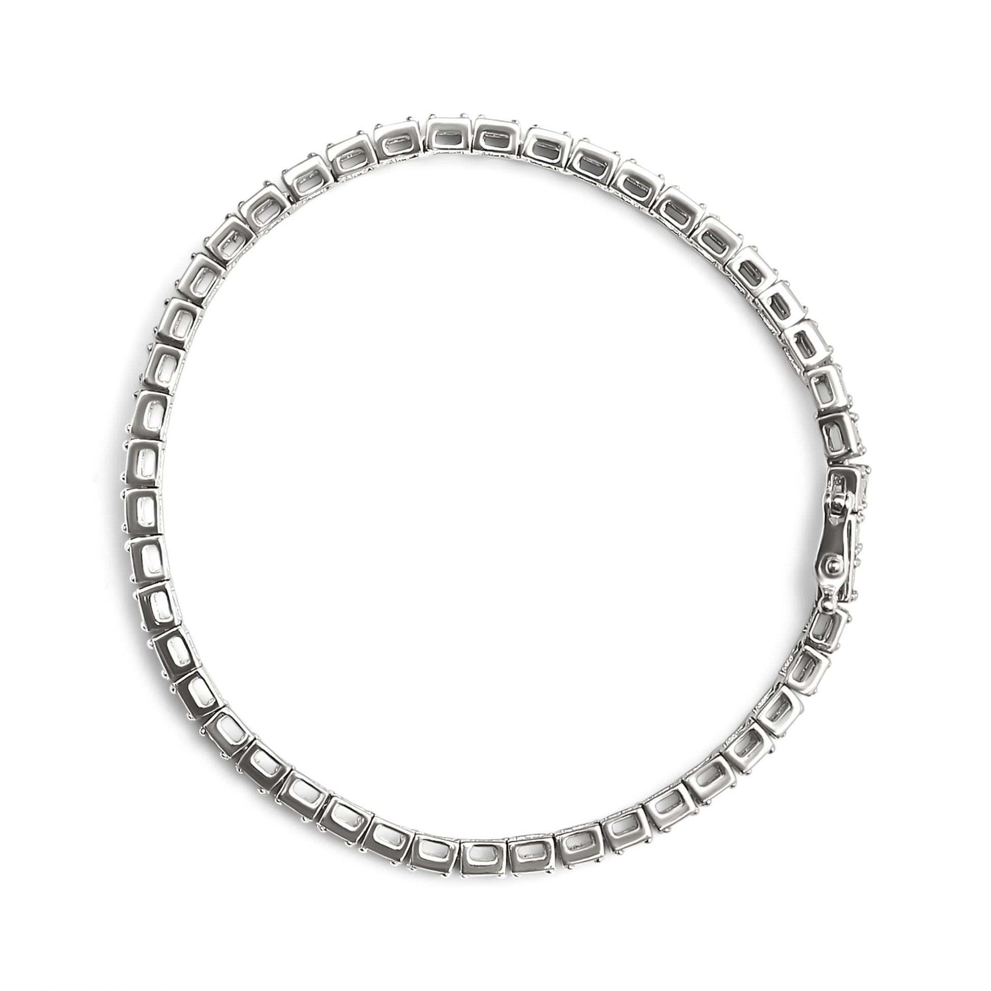 Top-down view of a white metal bracelet with square settings designed to hold round white gemstones in a miracle setting, shown unclasped.