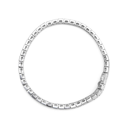 Top-down view of a white metal bracelet with square links featuring round white gemstones in a miracle setting.