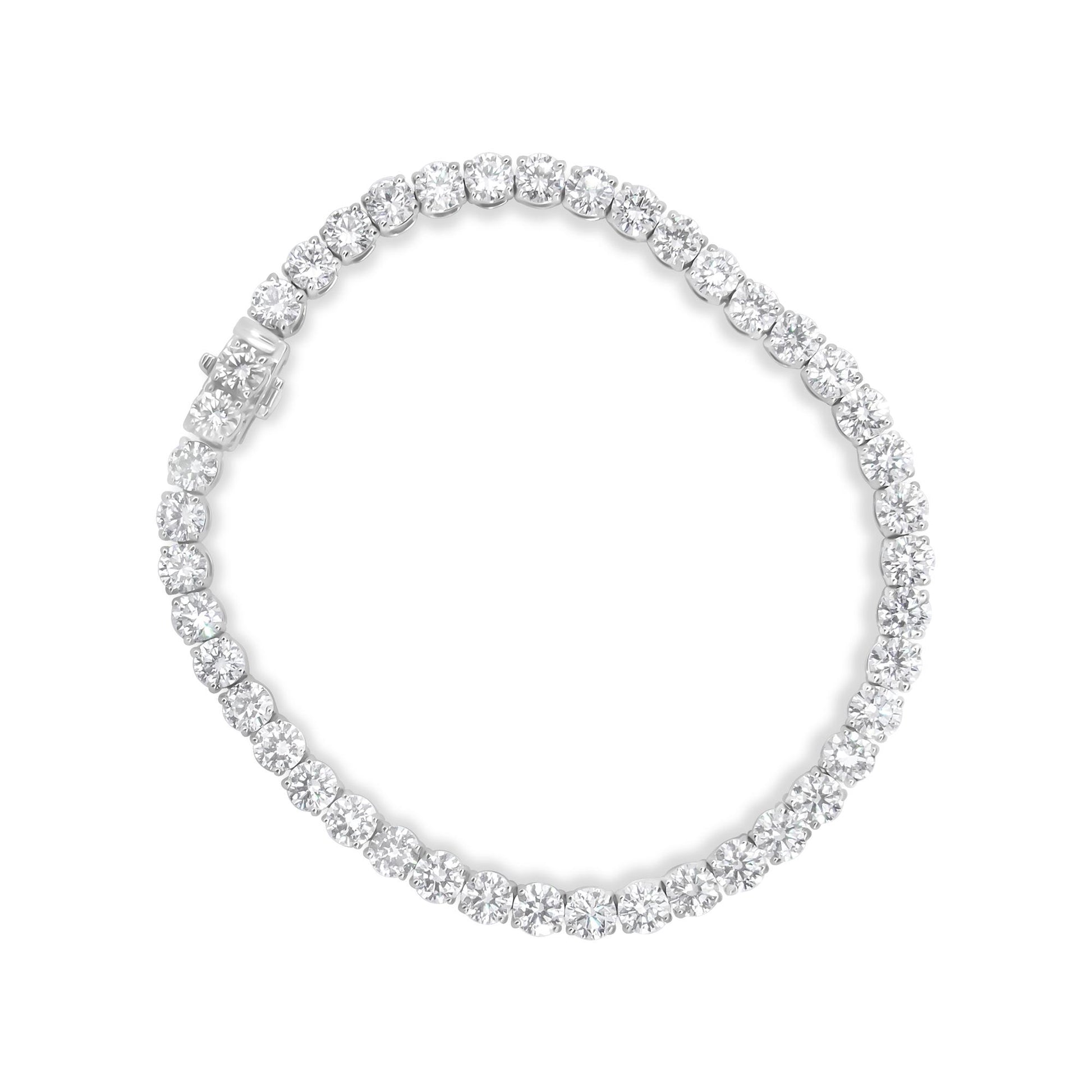 Top-down view of a white bracelet featuring a continuous row of round white gemstones in miracle settings.