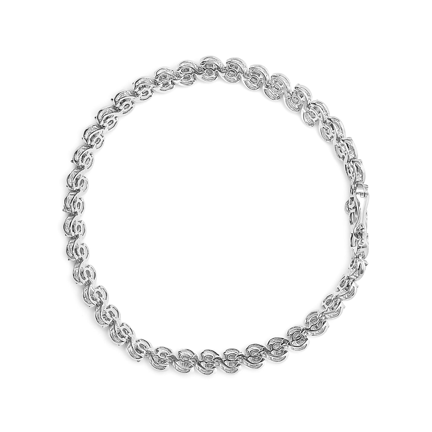 Top-down view of a white metal bracelet with round white gemstones set in a miracle setting along the entire chain.