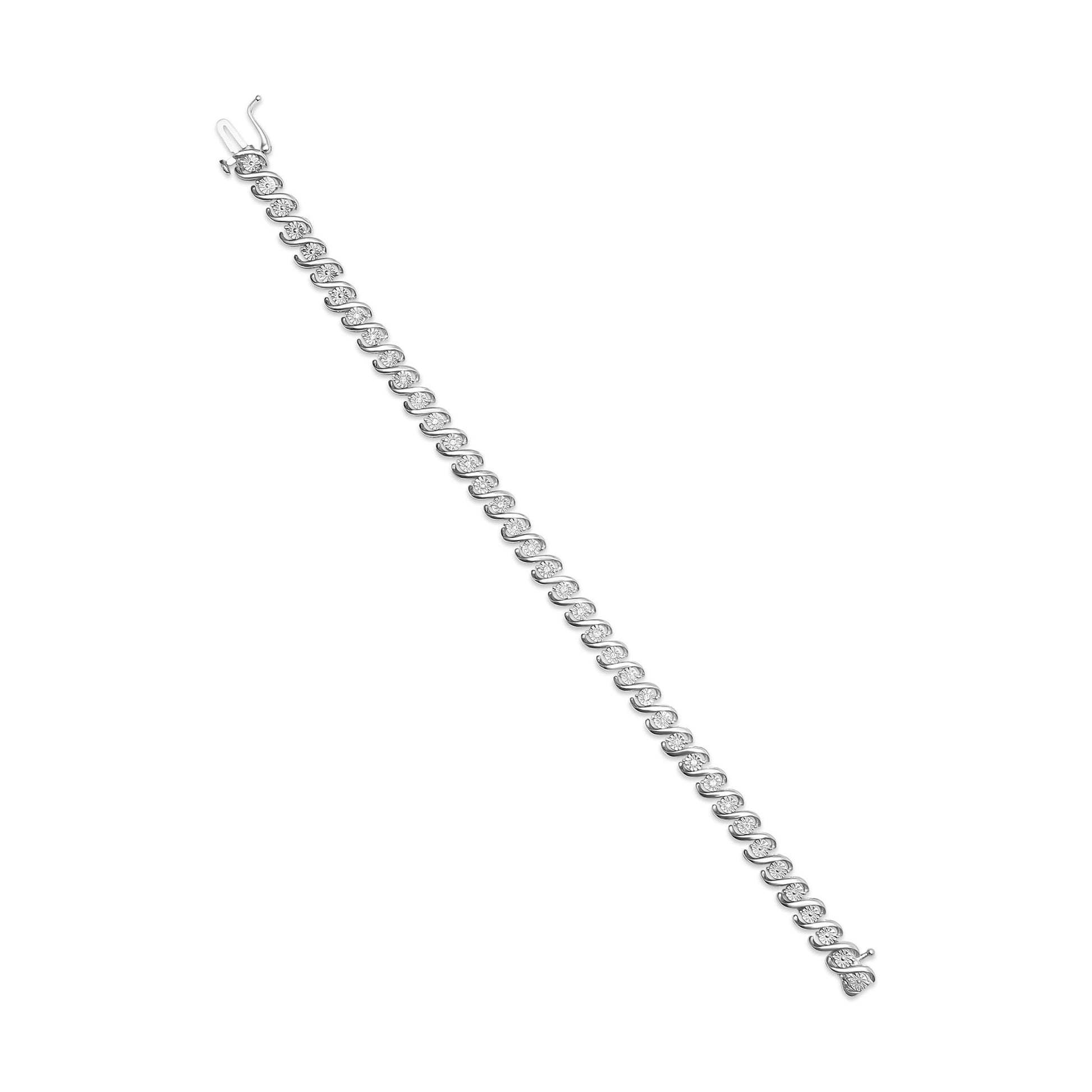 White metal bracelet with alternating links each set with round white gemstones in miracle setting, shown flat from a top angle.
