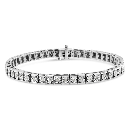 Close-up front angle of white metal bracelet with round white gemstones set in square links.
