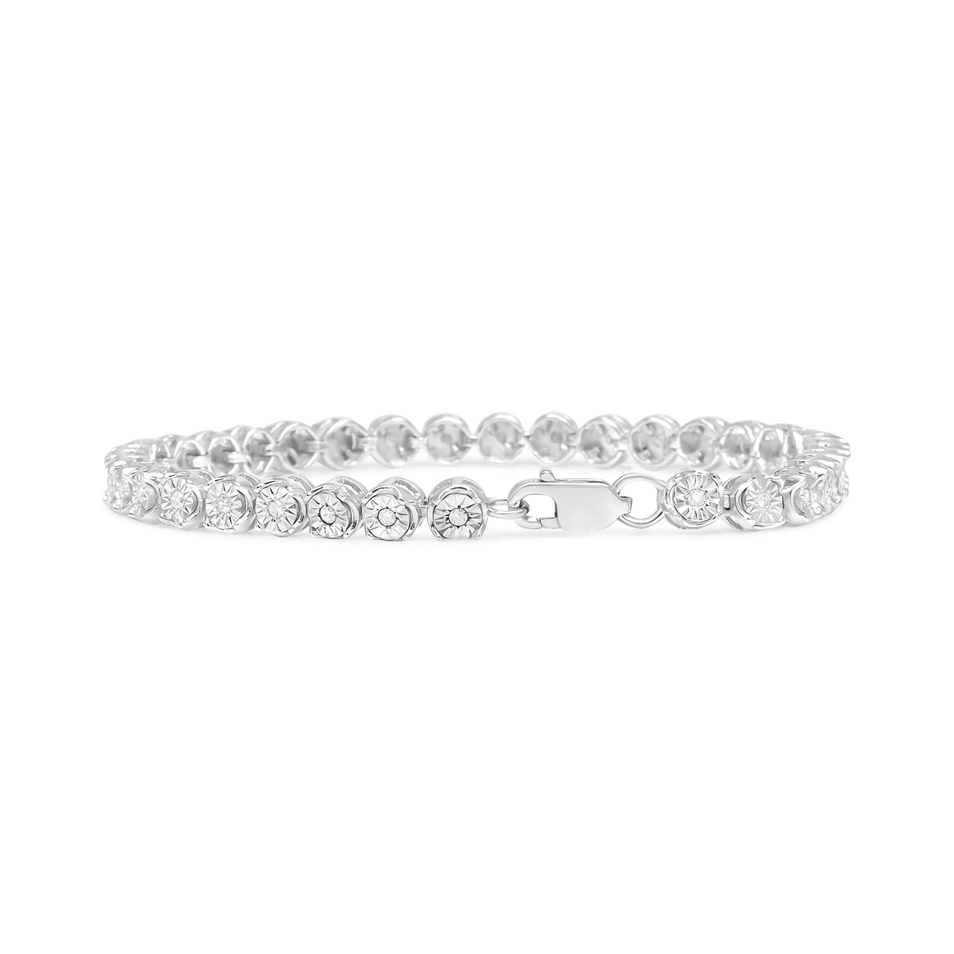 White metal bracelet with round white gemstones in miracle settings, shown from the front angle.