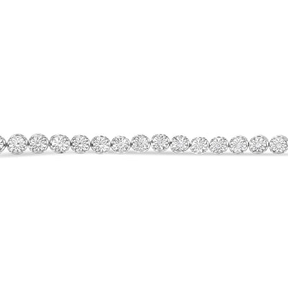 Close-up front view of a white metal bracelet featuring round white gemstones set in a miracle setting.