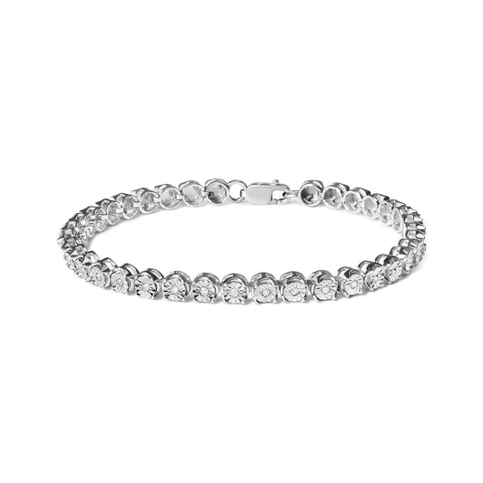 White metal bracelet with round white gemstones in miracle settings, shown from a front angle on a white background.