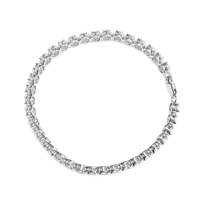 Top-down view of a white metal bracelet with round white gemstones in a miracle setting forming a continuous circle, clasp visible.