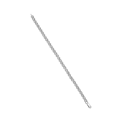 White metal bracelet with round white gemstones in miracle setting, photographed from an angled top view.