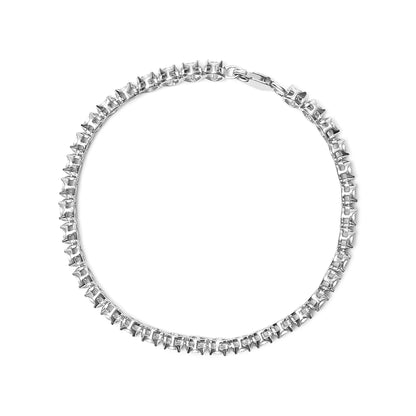 Top-down view of a white metal bracelet with round white gemstones in a miracle setting.