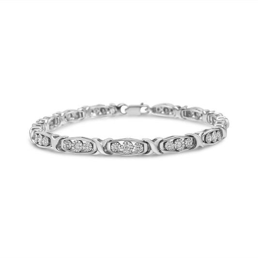 White metal bracelet with linked segments featuring clusters of round white gemstones in miracle settings, shown from a front angled view against a white background.