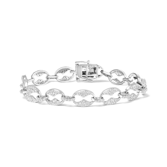 White metal bracelet with oval links adorned with small white gemstones, viewed from the front angle.