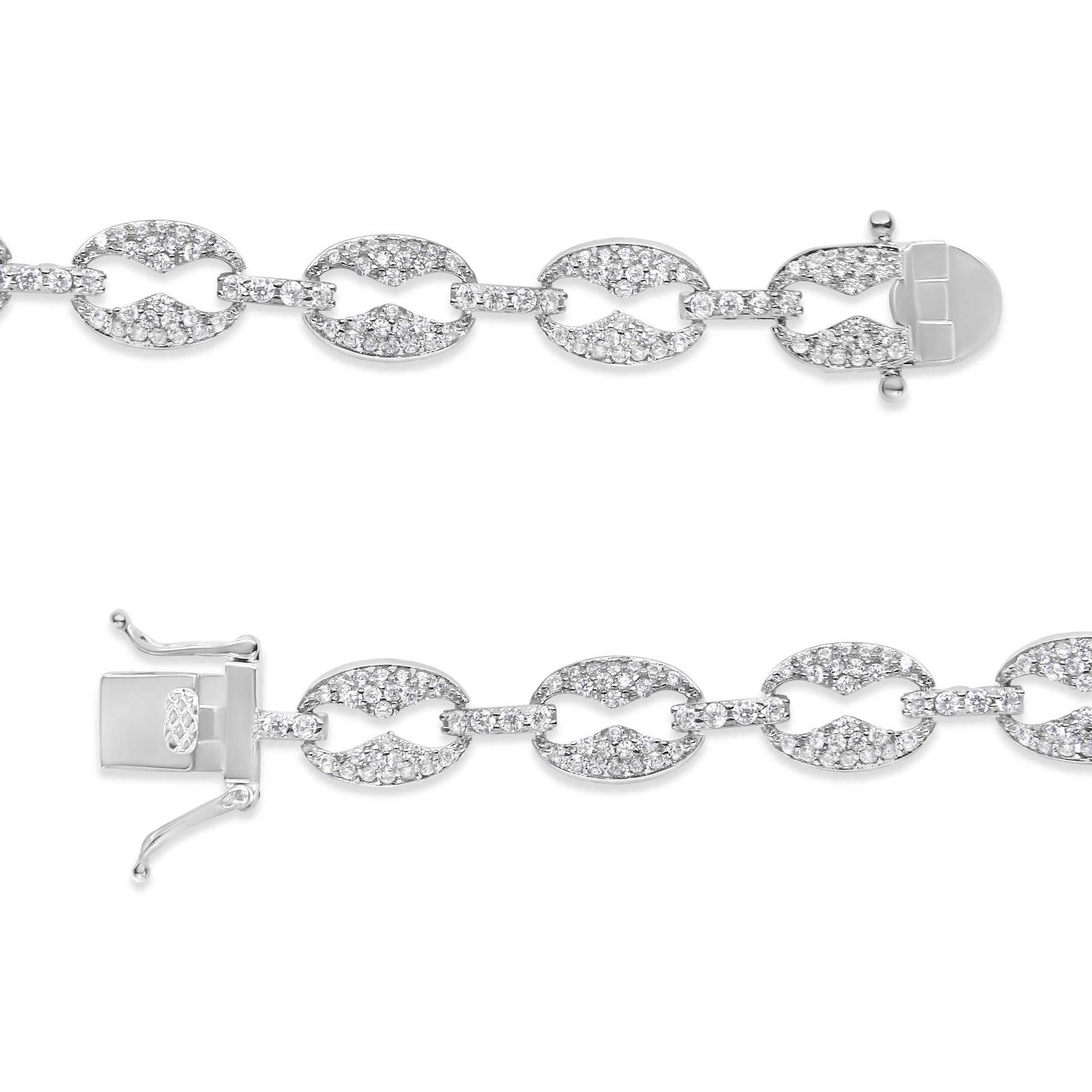 Close-up top-down view of a white metal bracelet featuring linked oval and bar segments encrusted with multiple small white gemstones in prong settings, shown unclasped and laid flat on a white background.