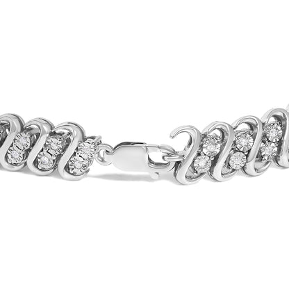 Close-up of a white metal bracelet with round white gemstones set in a twisted design, shown from a side angle.