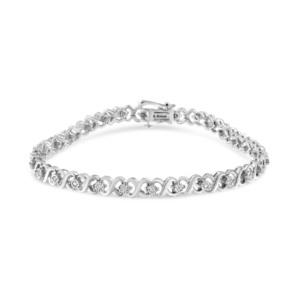 White metal bracelet with round white gemstones in a miracle setting, shown from a slight top angle.