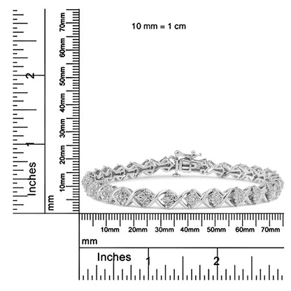 White metal bracelet with round white gemstones in prong settings, displayed flat on a ruler for size reference, front-facing angle.