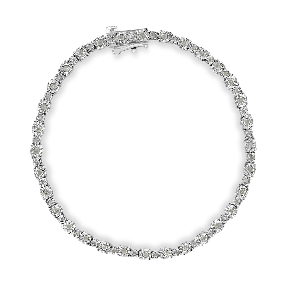 Top-down view of a white metal bracelet featuring round white gemstones in a miracle setting.