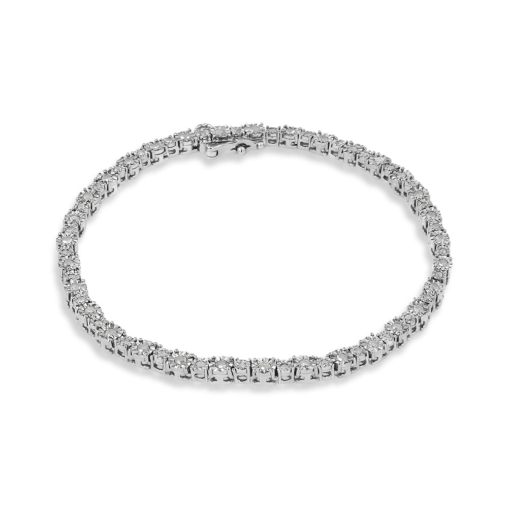 White metal bracelet with round white gemstones in miracle setting, shown from a top angled view on a white background.