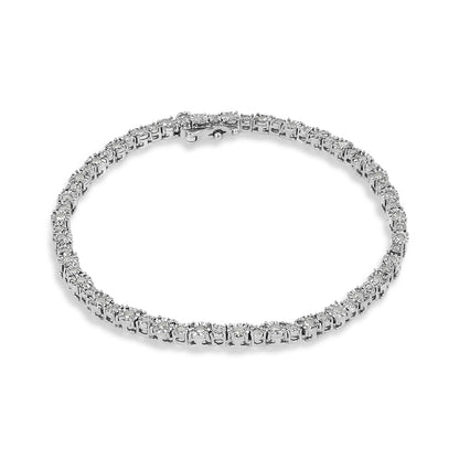 White metal bracelet with round white gemstones in miracle setting, shown from a top angled view on a white background.