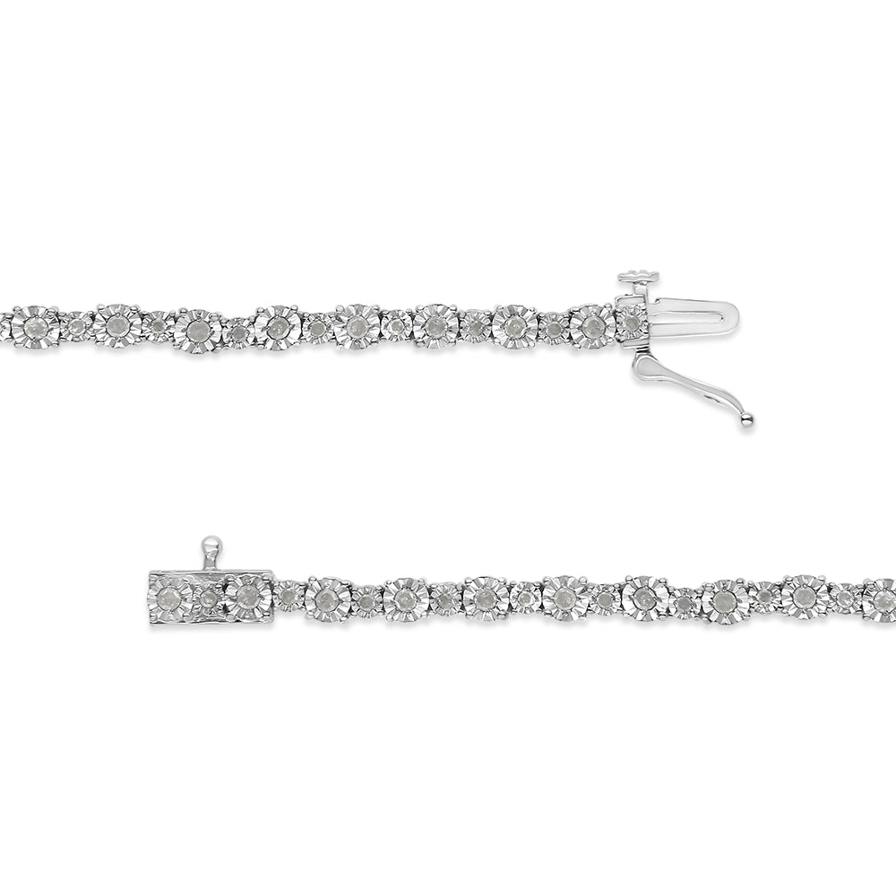Close-up top-down view of a white metal bracelet with round white gemstones set in a floral pattern in two rows, showing the clasp open.