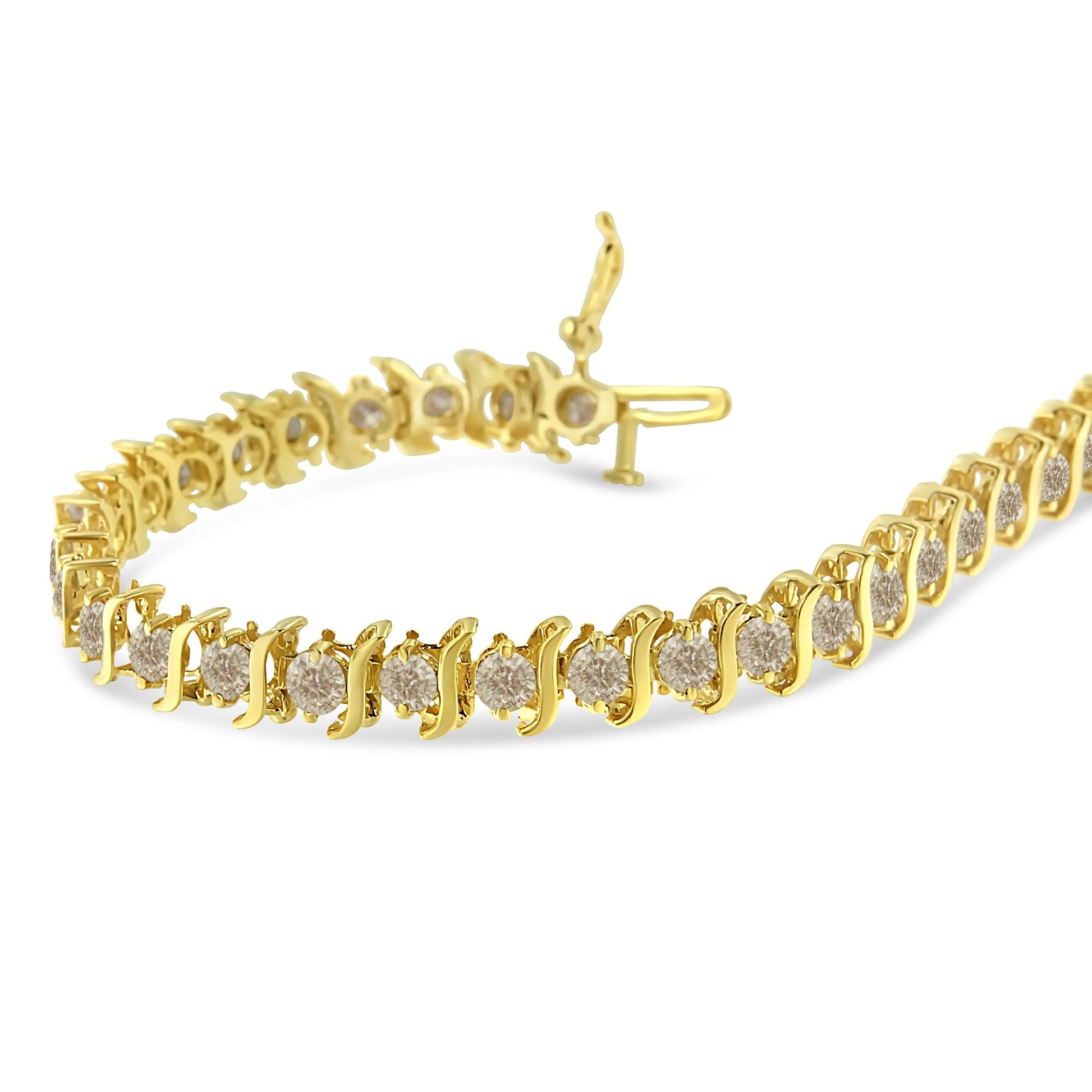 Close-up angle of a yellow metal bracelet with round white gemstones in prong settings arranged in a continuous line.