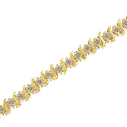 Close-up diagonal view of a yellow metal bracelet featuring round white gemstones set in prong settings in a repeating pattern.